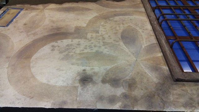 Detail of painted plaster wall.