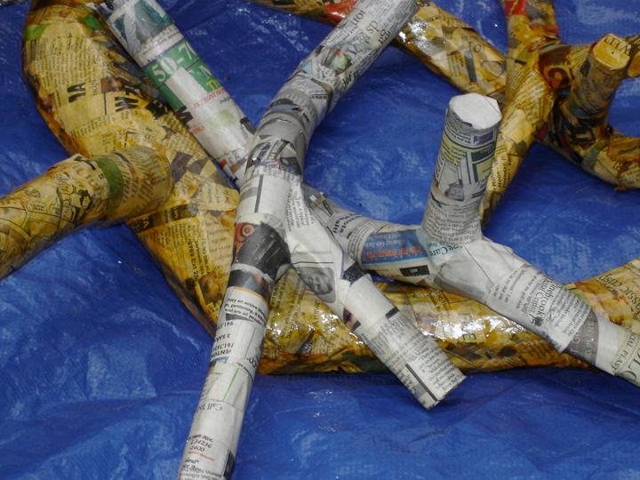 branches covered with paper strips backlit